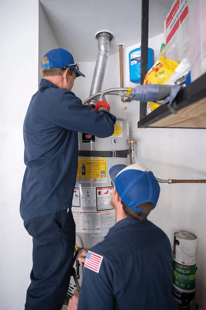 Water Heater Services in Las Vegas Valley | Active Plumbing. Two Active Plumbing plumbers performing a residential water heater installation and inspection.